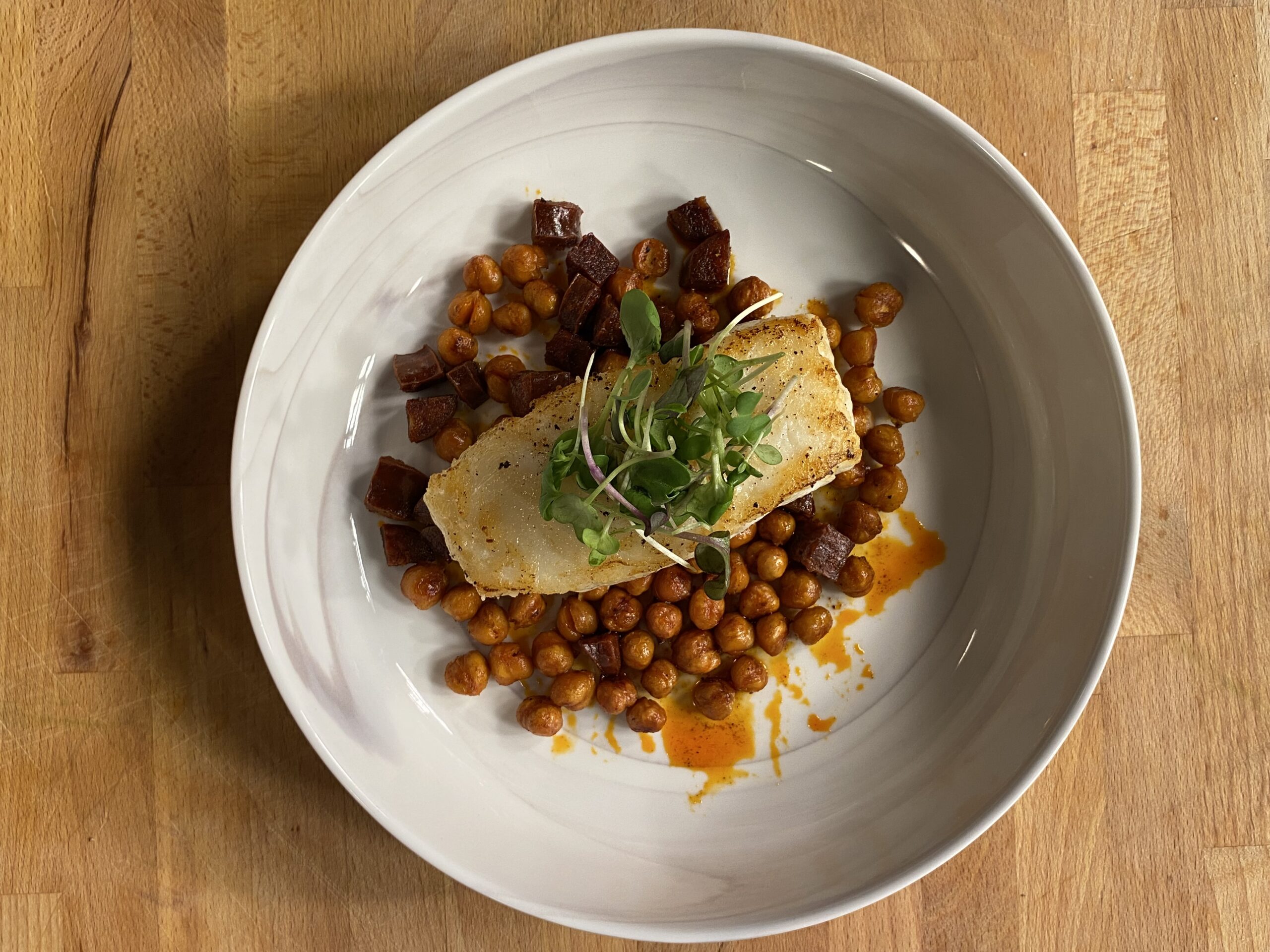 Pan-seared Chilean Sea Bass with Crispy Chickpeas & Chorizo